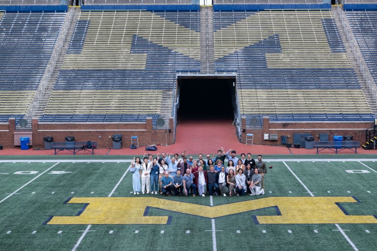 Mitsui Symposium - Finance Area faculty and students with presenters from the Mitsui Symposium on the field at the Big House