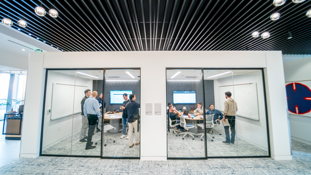 Several people gather in a room at the Michigan Ross Los Angeles campus.