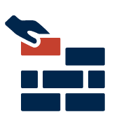 A hand laying a brick on a brick wall