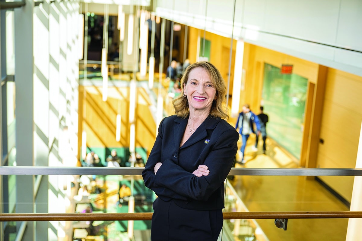 Dean Sharon Matusik on the stairs in the Winter Garden