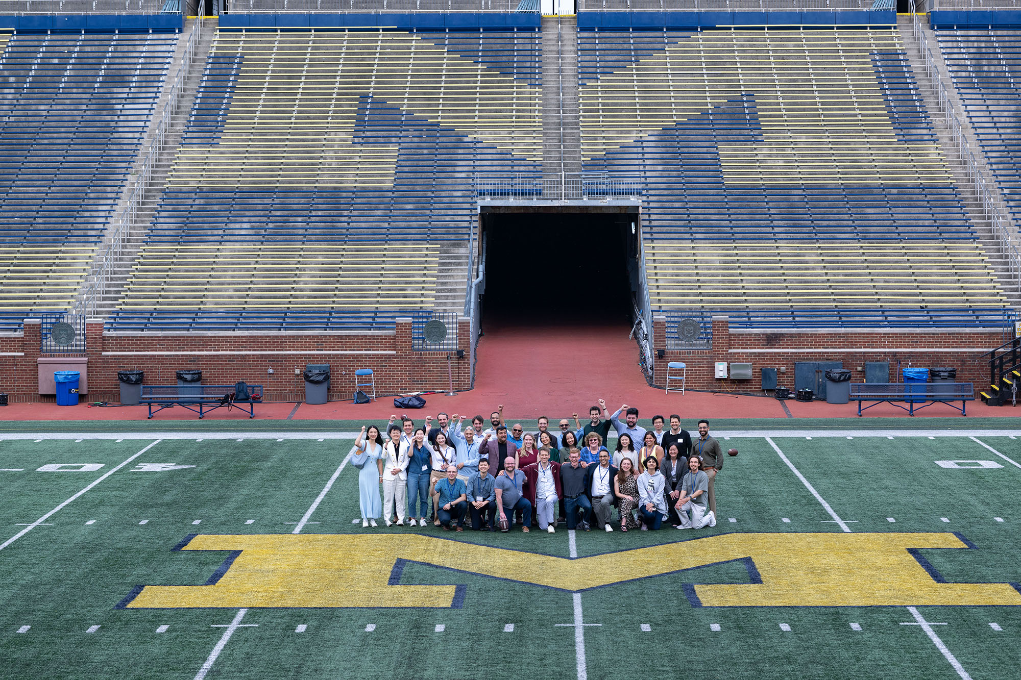 Mitsui Symposium - Finance Area faculty and students with presenters from the Mitsui Symposium on the field at the Big House